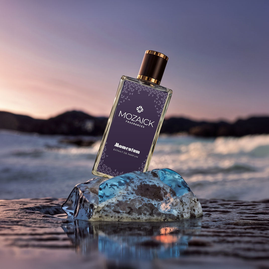 MOMENTUM Extrait de Parfum 50 ml by MOZAICK – bottle on a block of ice by the water at dusk